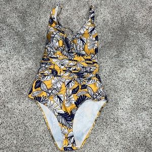 Yellow with blue flowers swimsuit. Cheeky bottom and strappy back. Size Medium